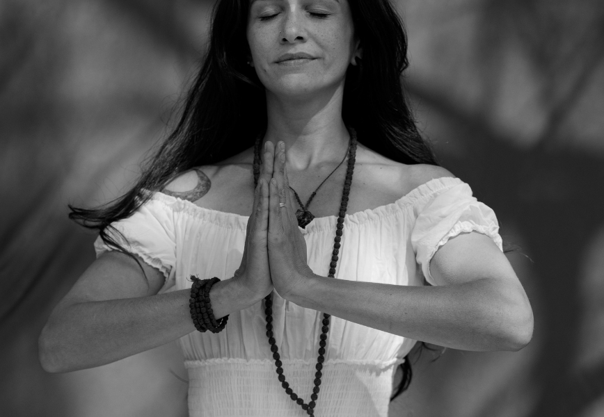 When to meditate - woman meditating - black and white photo