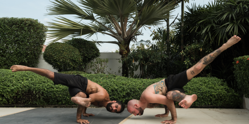 2 men doing yoga pose. benefits of yoga for men