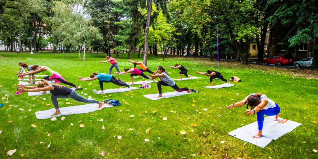 a group of women doing yoga. Benefits of daily yoga