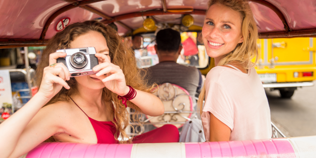 finding your life purpose - 2 women  exploring the city with camera